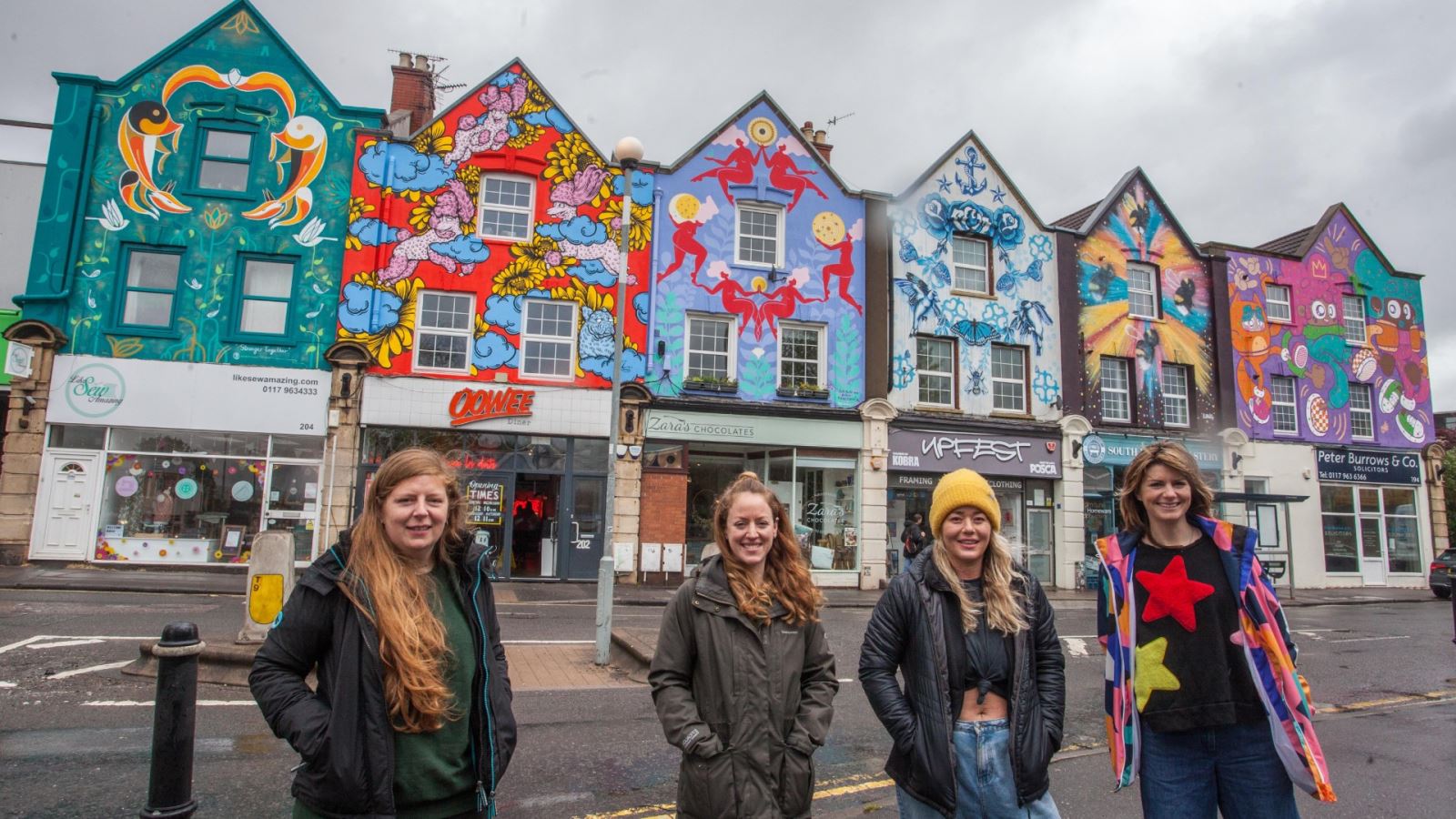 Left to right, artists EJITS, Bex Glover, Sophie Long, Lucas Antics in front of their mural